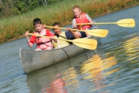 Boys in a canoe